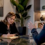 Attorney consulting with client in law office