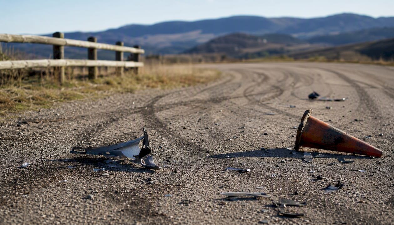 Close-up skid marks and debris at crash scene