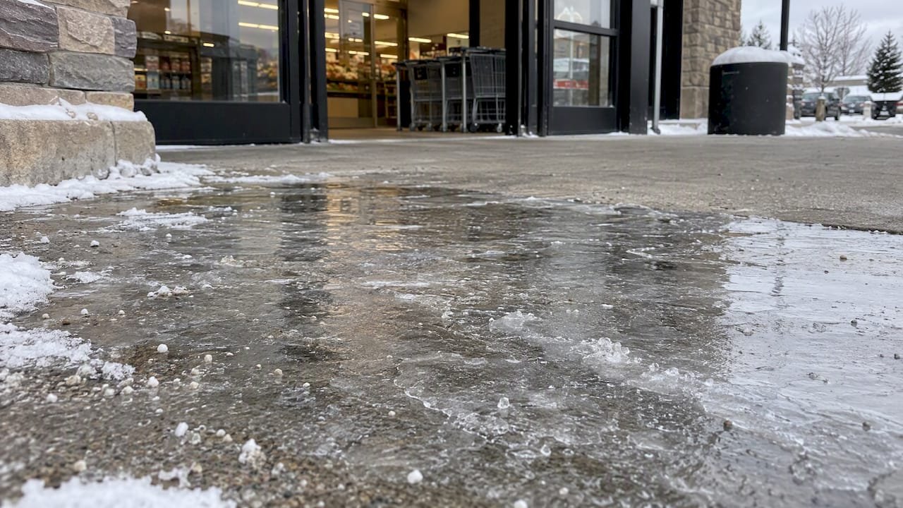 Refrozen ice on a grocery entrance walkway